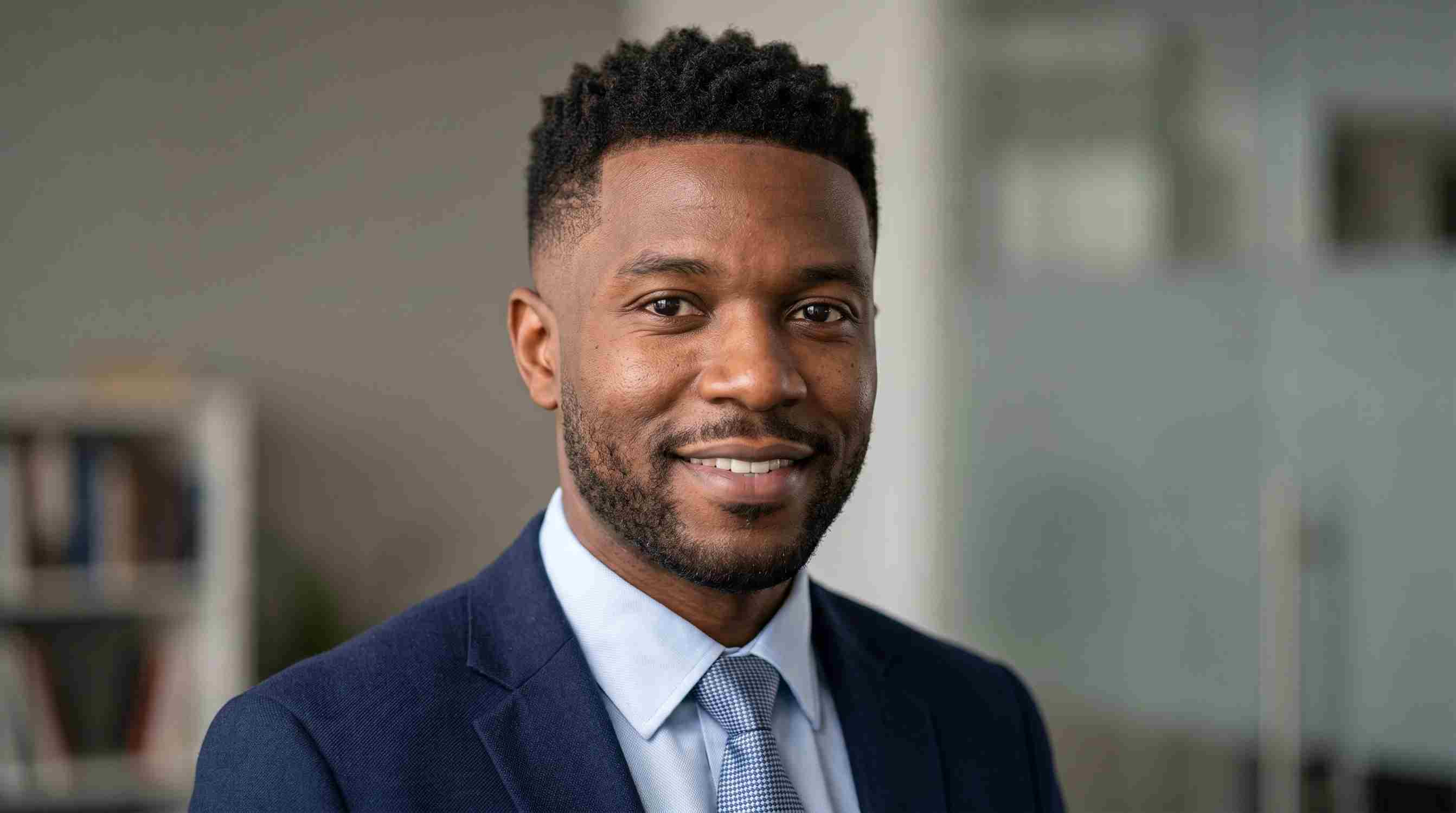 Low Taper Fade Black Male Perfect Uk Guide : 7 Styles, Guard Sizes & Barber Script 11 Low taper fade with textured crop haircut on a Black man, professional style with clean matte finish on top.